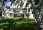 Key Largo, Florida Bed and Breakfast:  Tarpon Flats, with its Old Key West charm and elegant furnishings is located just 60 miles south of Miami on the island of Key Largo. Standing on our shoreline you have a panoramic view of Largo Sound, John Pennekamp Park and the rising sun. In season watch tarpon roll within yards of our private sandy beach area.  