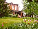 Whispering Pines Bed & Breakfast is located on the edge of Nebraska City, Nebraska, on 6 1/2 acres with hundreds of flowers and surrounded by trees.