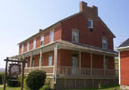 A charming bed & breakfast inn that once served as a stagecoach stop along Glades Pike and played an important role in the 19th Century history of the area. Glades Pike Inn was carefully restored to a first-class bed & breakfast inn, while preserving its 19th Century charm. Conveniently located on Route 31 between the Donegal and Somerset exits of the Pennsylvania Turnpike. Its period architecture features exposed wood floors, high ceilings and brick construction.